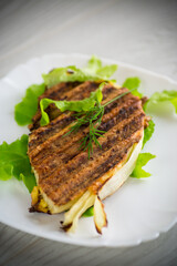 piece of grilled baked cabbage with spices in a plate