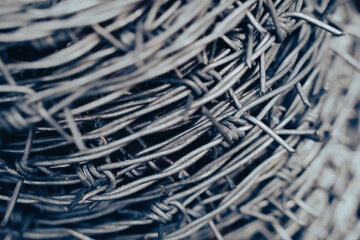macro detail of roll of steel barbed wire