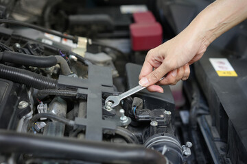 Technician engineer check the engine car daily, maintenance and repair concept