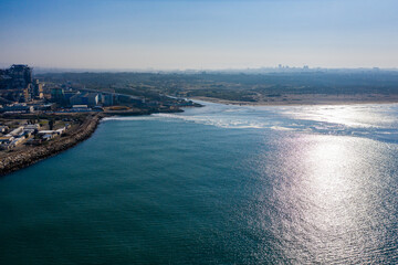 Naklejka premium Big coal power station with tall chimnies and coal conductor and white steam - aerial shot in Hadera
