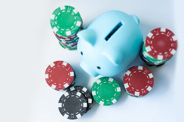 Piggy Bank and Poker Chips Isolated on White.