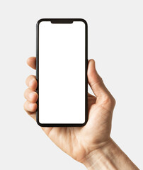 Phone mockup in hand - clipping path, Studio shot of smartphone with blank white phone screen for...