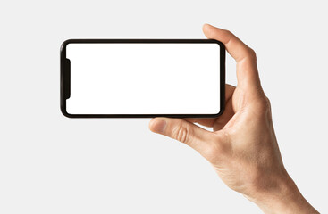 Phone mockup in hand - clipping path, black smartphone with blank mock up screen for web site design isolated on white background, app for mobile phone and advertisement