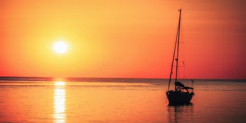 Fensteraufkleber sailboat at sunset © andiz275