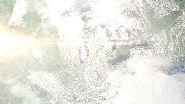 Earth zoom in from outer space to city. Zooming on Grand Rapids, Michigan, USA. The animation continues by zoom out through clouds and atmosphere into space. Images from NASA