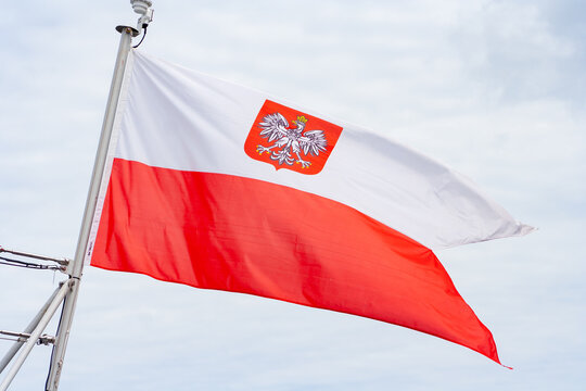 Polish flag in city. Patriotism concept. Flag on wind. Demonstration in Warsaw
