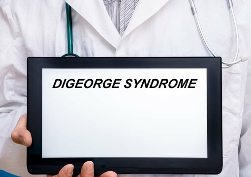 Digeorge Syndrome.  Doctor With Rare Or Orphan Disease Text On Tablet Screen Digeorge Syndrome