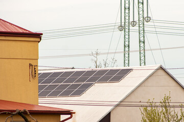 Solar panels on the roof of the building. The concept of savings through the use of renewable energy