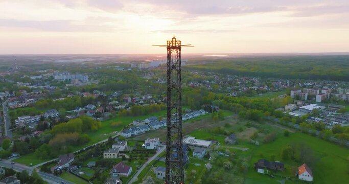 Aerial view of the wooden broadcasting tower in Gliwice with the city of Gliwice in the background. The concept of the largest wooden tower in the world. Wooden construction from a drone.