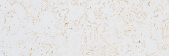 Dolomite texture. Natural rock with beautiful beige patterns on the surface. Polished flat stone. Classic luxury decoration building material. Wide panoramic texture for background and design.