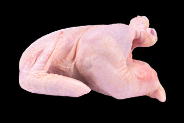 Fresh raw chicken isolated on black background with clipping path. Side view. Whole fresh chicken isolated.