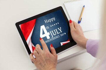 man searching website with information of the celebration of Independence Day hands of a man looking in web a site with information of 4th July