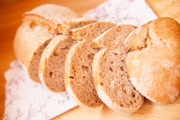 Tasty fresh brown bread on the table, simple still life