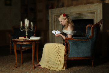 Young singer woman with phantom mask in retro interior, portrait