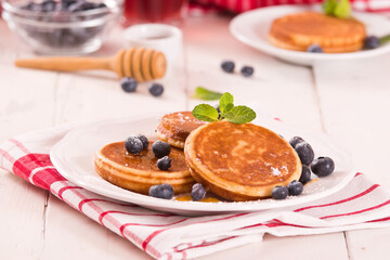Pancakes with blueberries and chocolate cream.