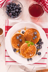 Pancakes with blueberries and chocolate cream.