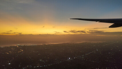 Beautiful sunset, sky in the view inside an airplane, view from inside the window.
