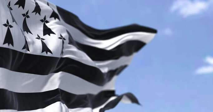 Rear view of the Brittany flag waving in the wind on a clear day