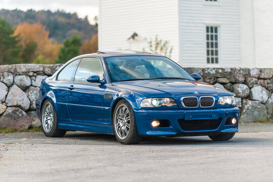 Lindesnes, Norway - October 15 2011: Blue BMW M3 E39 car by a stone wall.