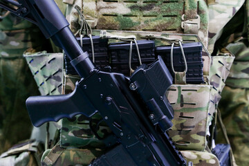 A machine gun with a magazine and a pouch in close-up.