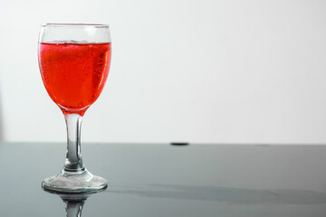 Red drinks in wine glass. 