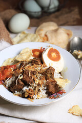 Rawon or Nasi Rawon (Rawon Rice) is a strong rich tasting traditional Indonesian beef black soup served with sprouts, kluwek seasoning. From east java