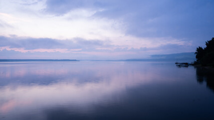 Fototapeta premium Peaceful and colorful sunrise view on a big lake, Slovakia, Europe