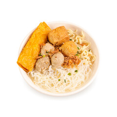 Hot traditional indonesian meatballs bakso with fried tofu, noodles, vegetables and gravy broth