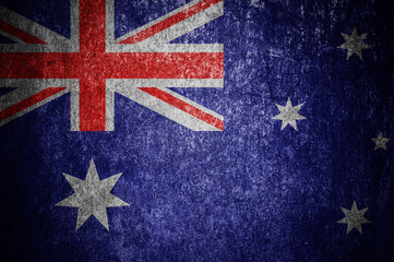 Closeup of grunge Australian flag. Dirty Australia flag on a metal surface
