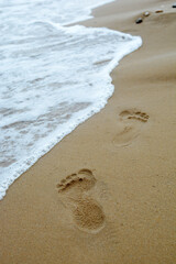 Female footprints in the sand