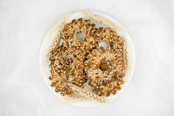 Delicious cookies with sesame seeds and flax. baking according to homemade recipes on a plate top view