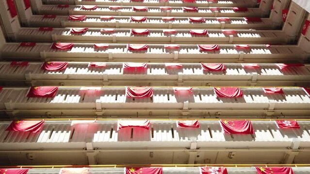 flags for celebrate the 25th anniversary of the establishment of the Hong Kong Special Administrative in Ping Shek Estate, Hong Kong