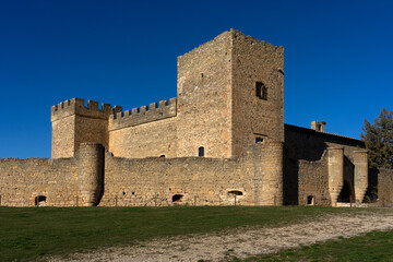 Fototapeta na wymiar Castle of the medieval village in a sunny day. Segovia, Castilla y Leon, Spain