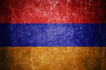 Closeup of grunge Armenian flag. Dirty Armenia flag on a metal surface