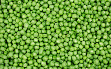 Green peas. Green background. Pea background. View from above. Green pea background. Pea pods from farmland. Pea freshly picked. Organic fresh vegetables. Healthy eating. Country garden harvest.
