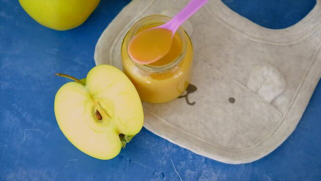 Baby applesauce in a jar. Selective focus.