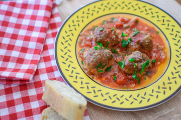 Round meatballs from Romanian traditional cuisine with bolognese sauce