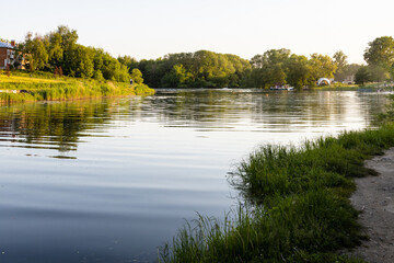 Fototapeta na wymiar Kolomenka river in Kolomna city at summer sunset
