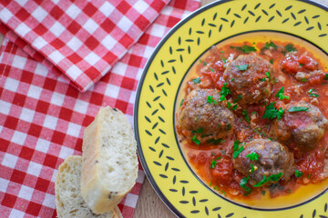 Round meatballs from Romanian traditional cuisine with bolognese sauce
