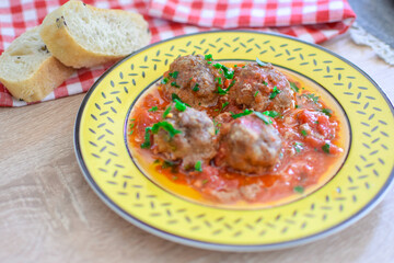 Round meatballs from Romanian traditional cuisine with bolognese sauce