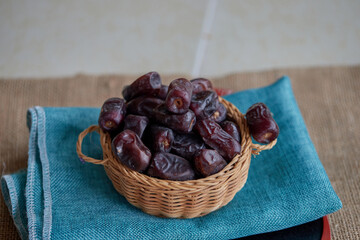 Dried dates in wicker basket