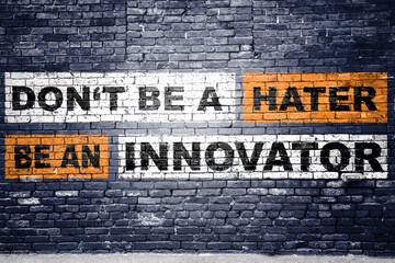 Don't be a hater be an innovator Motivation Quote Graffiti on Brick Wall