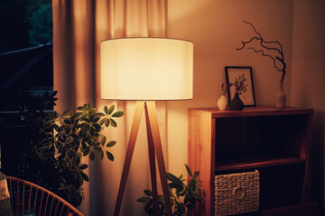 Lamp illuminating a living room with warm light