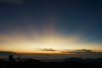 Mountain Sunrise with rays of sun scattered all over