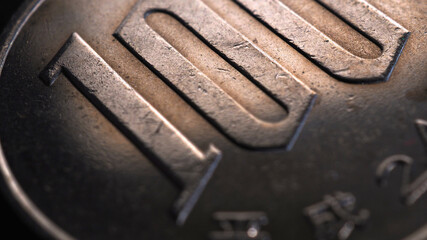 Translation: year of issue 2012. Japanese 100 yen coin close-up. Brown tinted illustration for news...