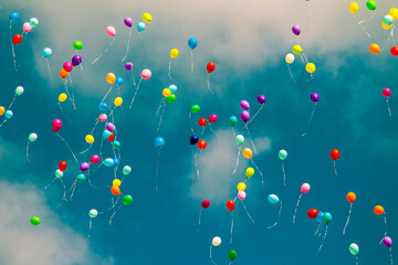 Colorful balloons flying into the sky