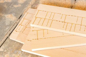 Pile of glued boards ready in the carpentry workshop