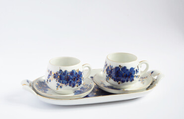 Vintage porcelain coffee set with blue flower pattern