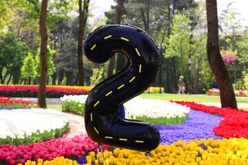 A flying balloon in the shape of the number 2 inside tulips for her birthday in Istanbul Emirgan