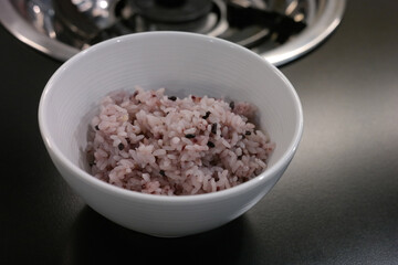 Multigrain rice is served in a white bowl.